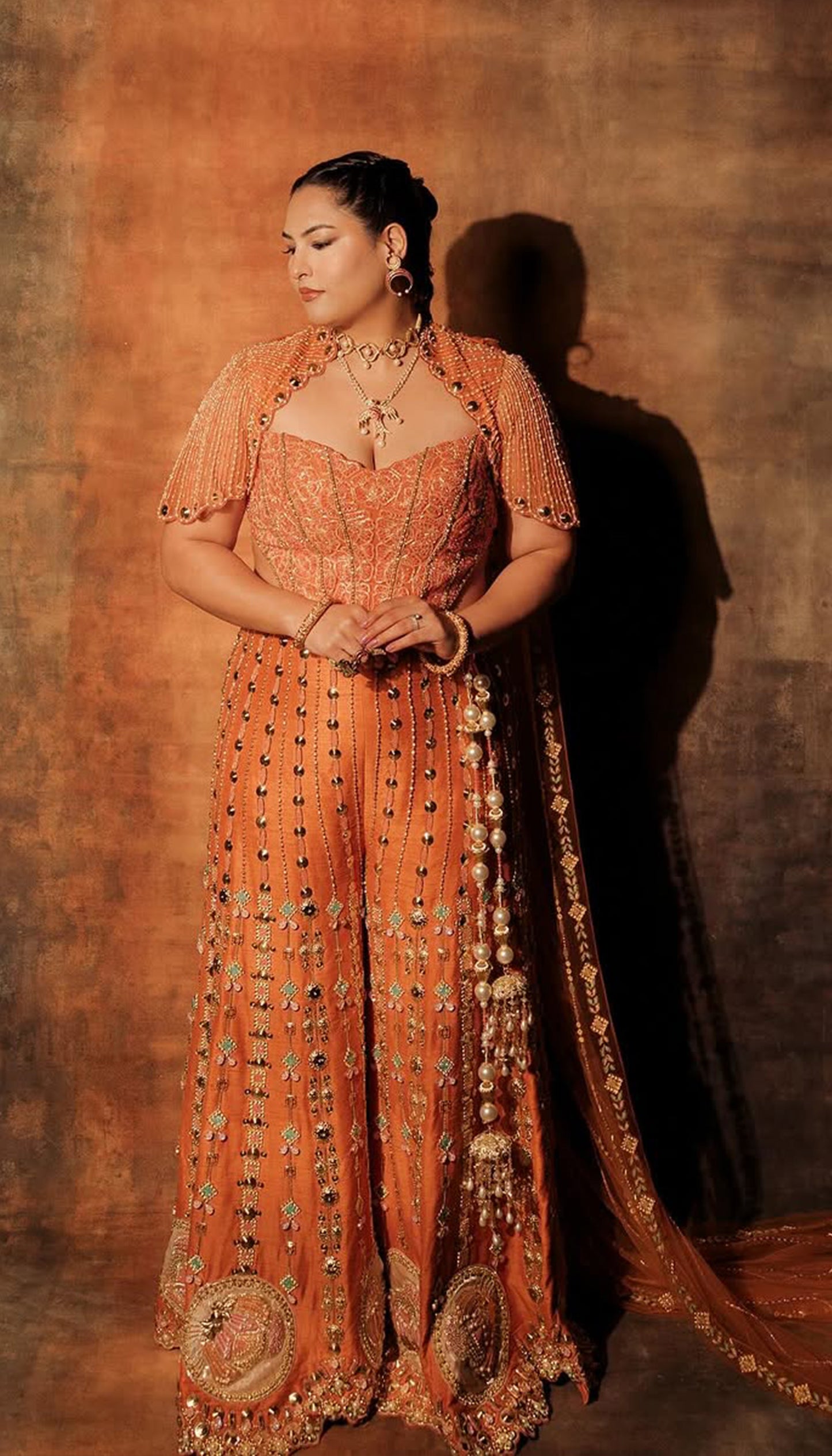 SAKSHI IN CEO OF ART - ORANGE SHARARA SET