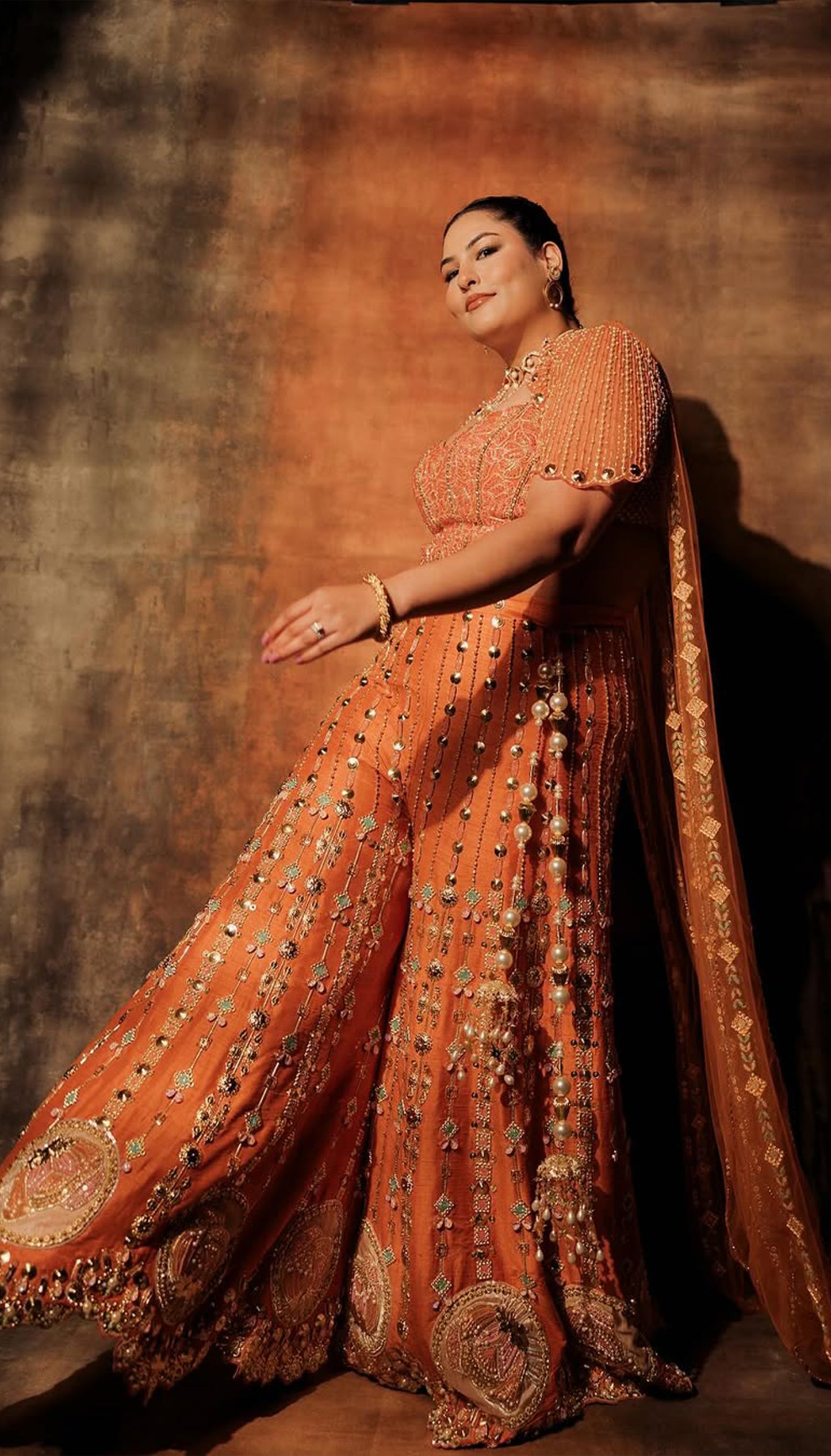 SAKSHI IN CEO OF ART - ORANGE SHARARA SET